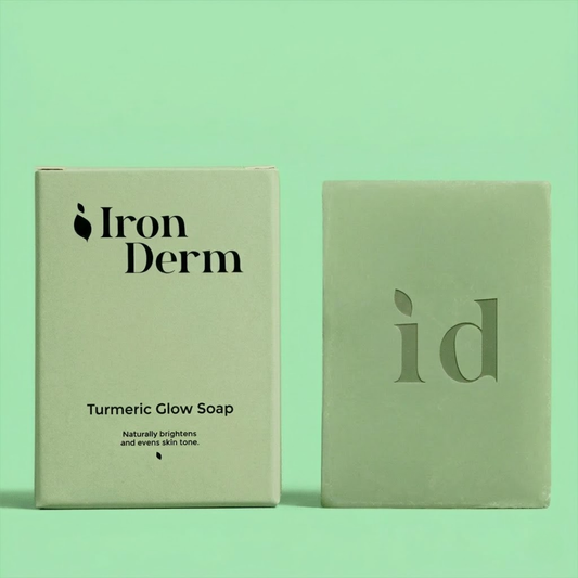 NAIA Turmeric Fade & Glow Bar soap with turmeric and natural ingredients for radiant skin, shown in a close-up image.